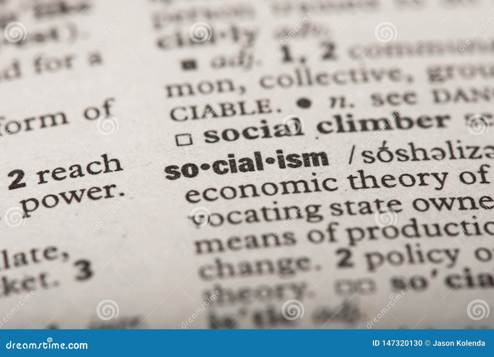 closeup of the word `socialism` in a dictionary