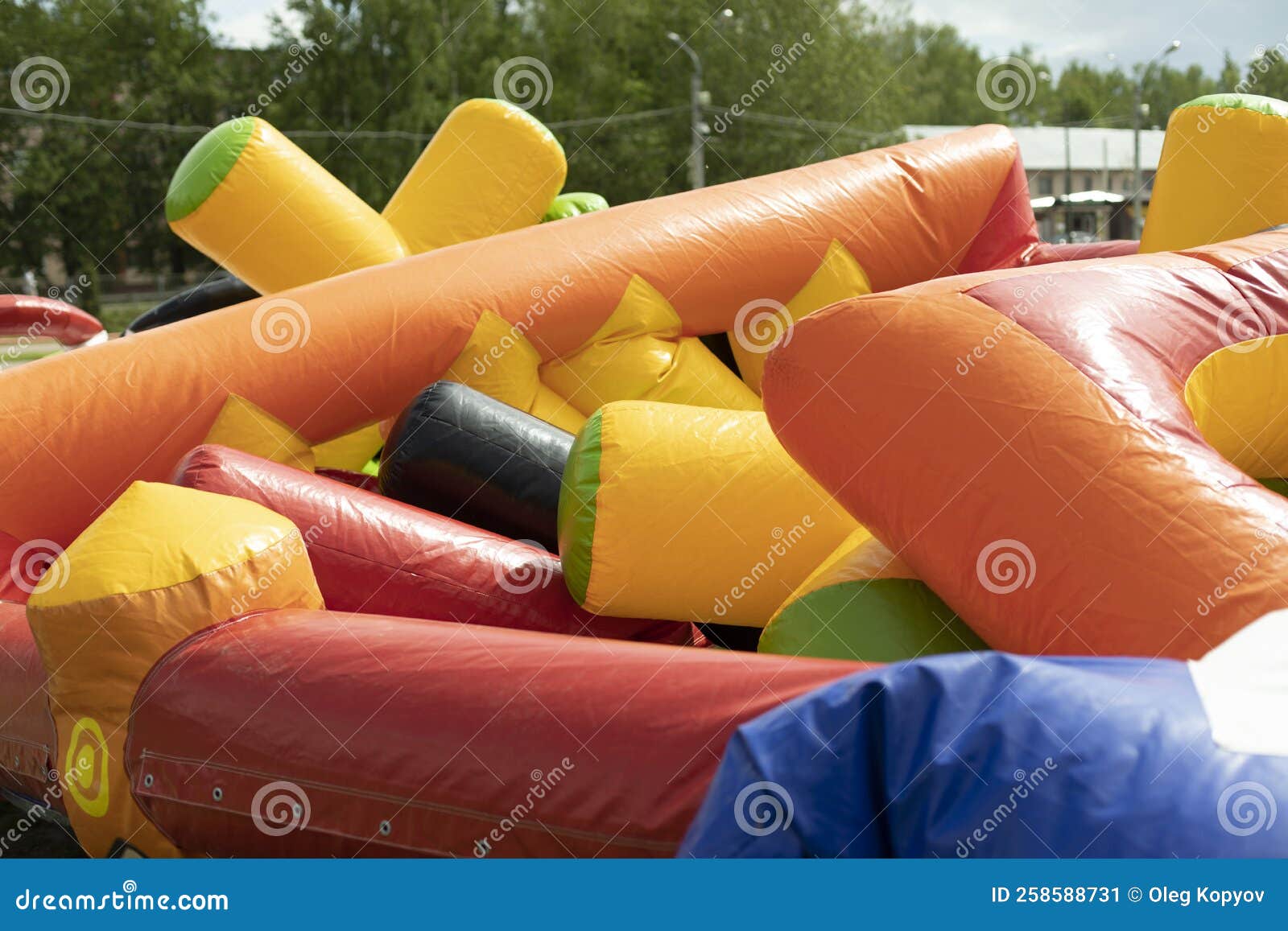 deflate obstacle course in amusement park. air escapes from inflatable structure. details of collection of attractions