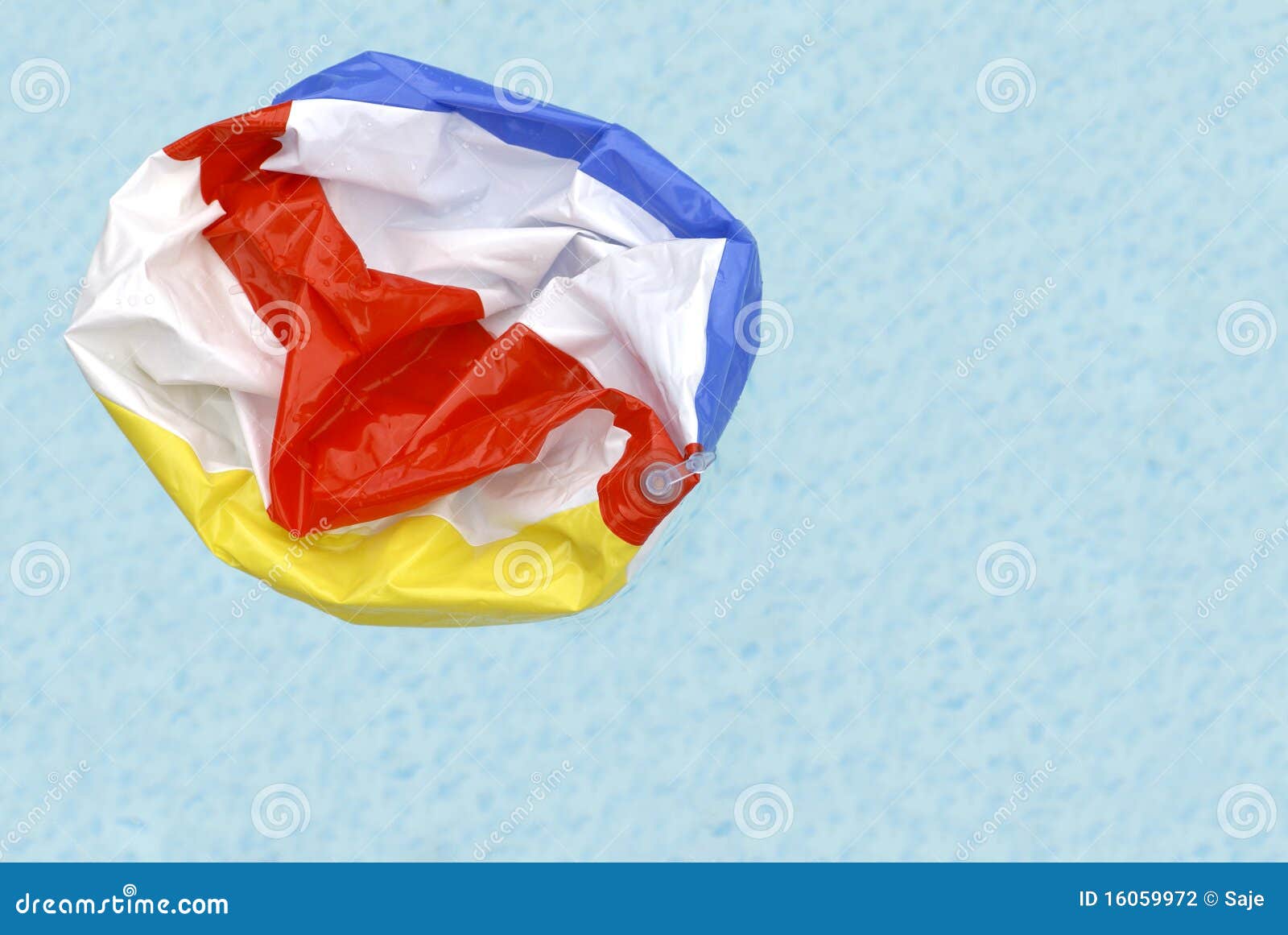 deflated beach ball in pool