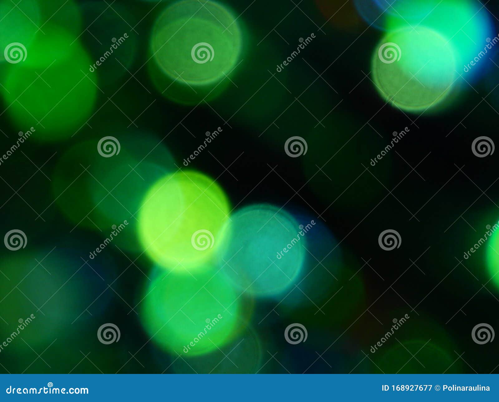 defocused bokeh circle green and blue night lights background texture.