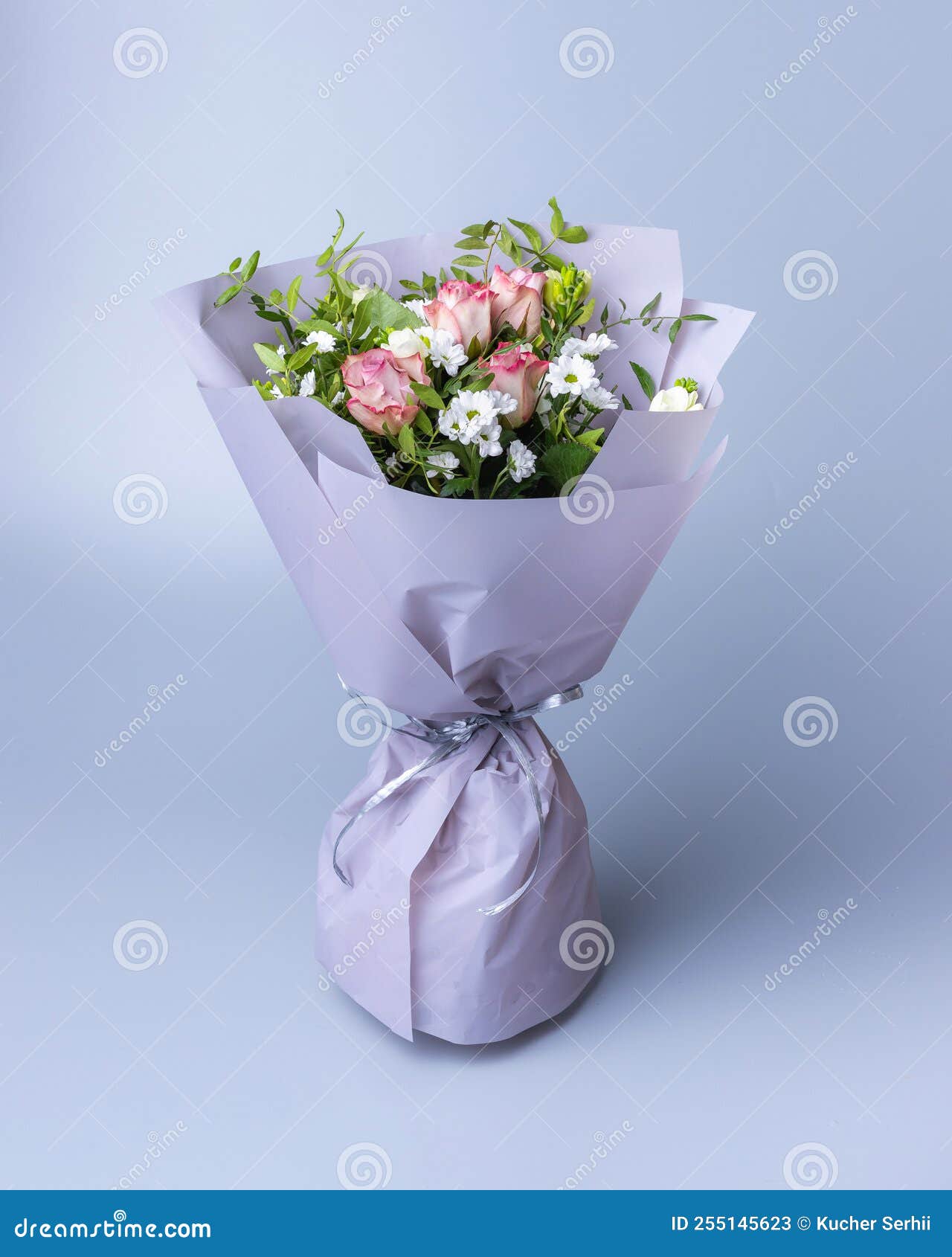 Delicate Bouquet of Roses Wrapped in Bright Floral Paper Stands on a Blue  Background. Stock Image - Image of plant, banner: 255145623