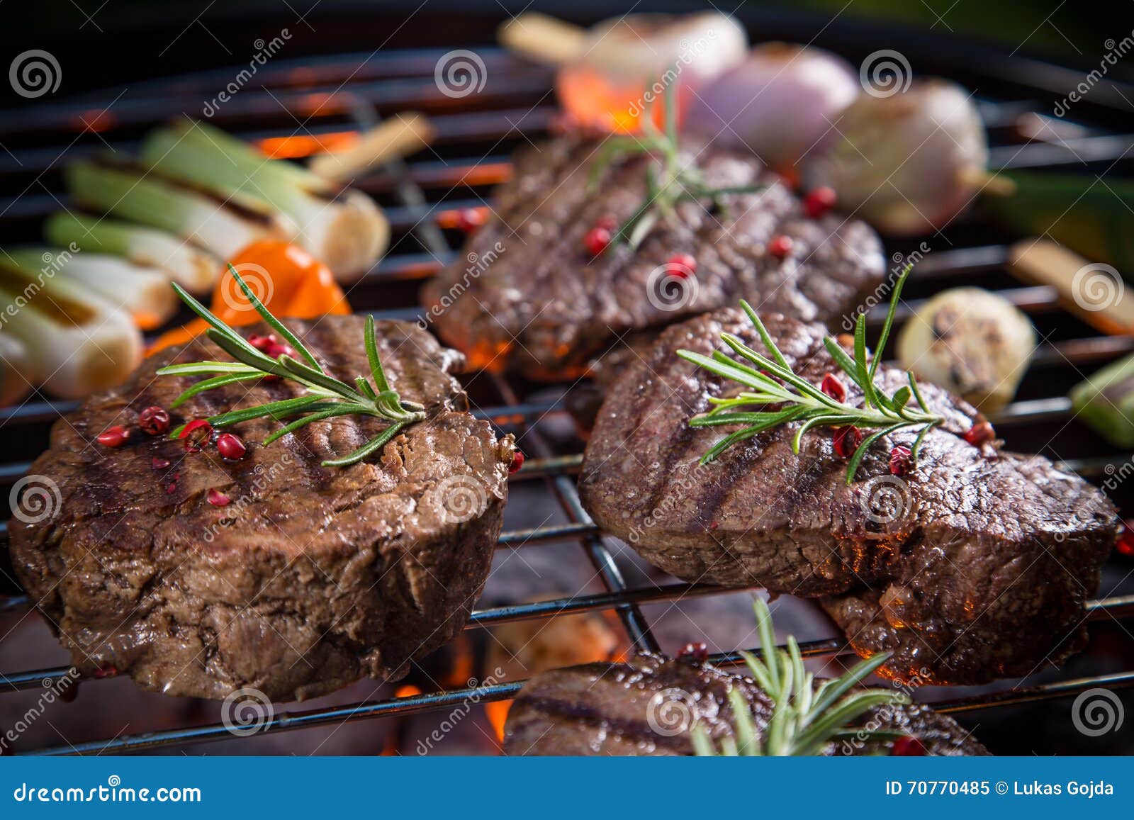 Delicious Beef Steaks with Vegetable on a Barbecue Grill. Stock Image