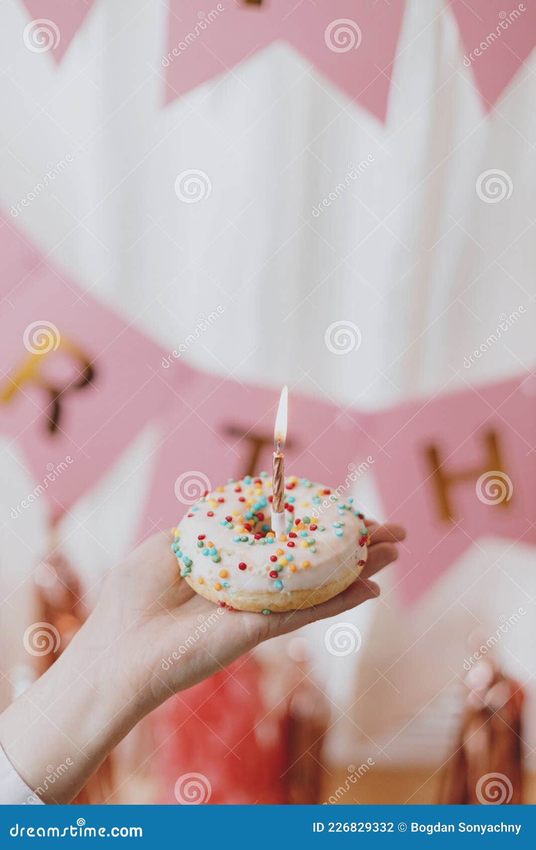 Delicious Birthday Donut with Candle in Hand on Background of Pink ...