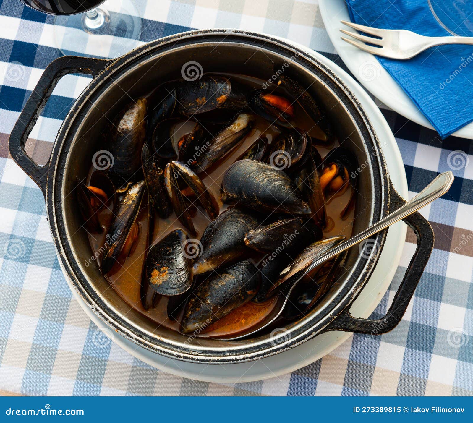 delicious boiled mussels with tomato sauce and parsley
