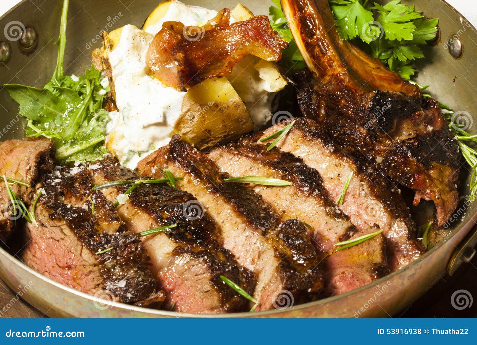 Delicious Bone in Rib Eye Steak Served in Steel Pan Stock Photo Image