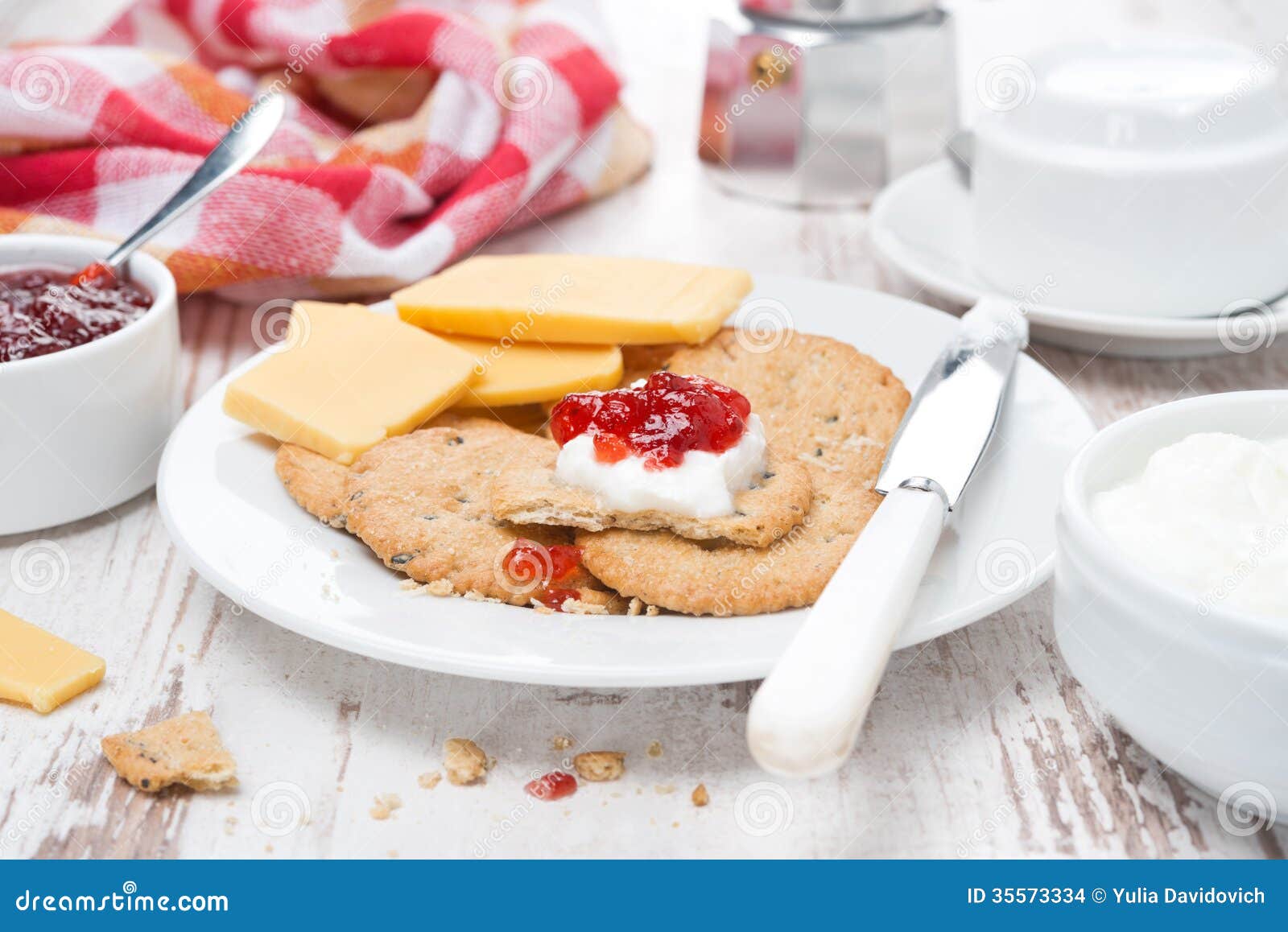 Delicious Breakfast with Crackers, Cream Cheese and Berry Jam Stock