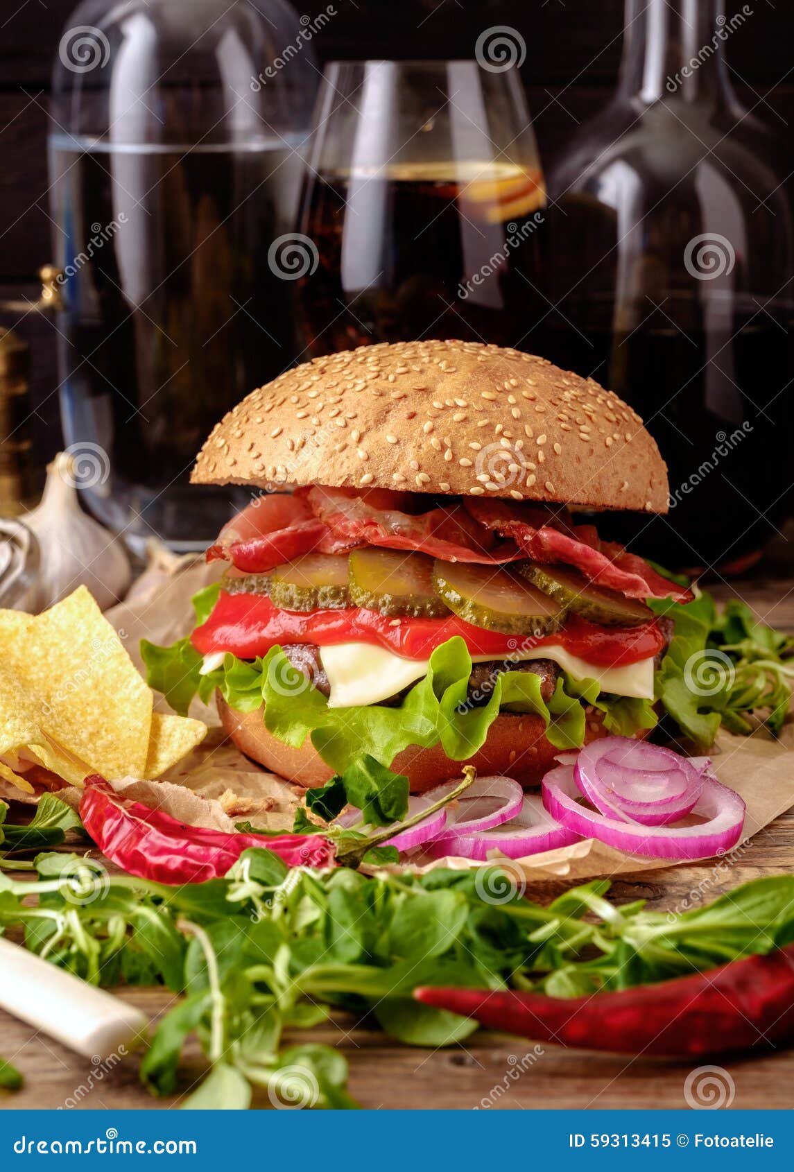 Delicious Burger with Chips and Soda on Wooden Table. Stock Image