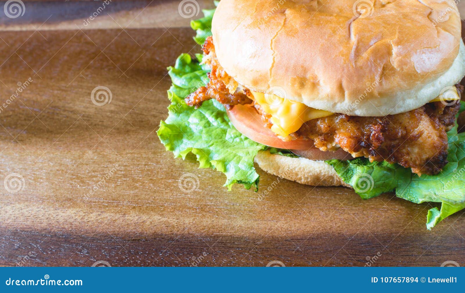 delicious chicken sandwich on wood tray