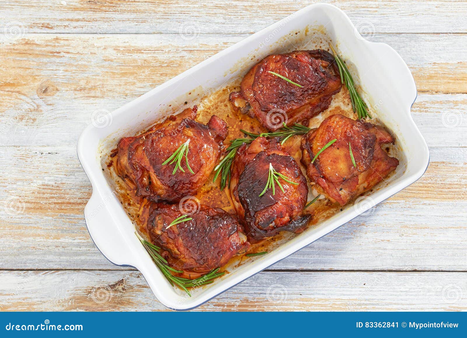 delicious chicken thigh roasted in rectangular baking dish