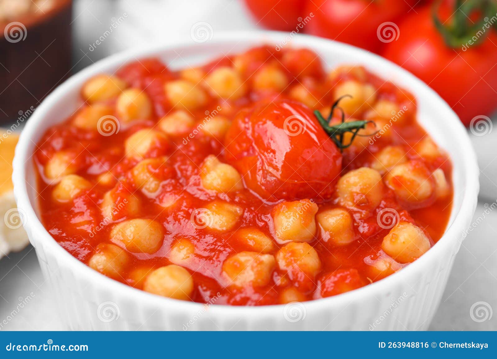 Delicious Chickpea Curry in Bowl on Table, Closeup Stock Photo Image