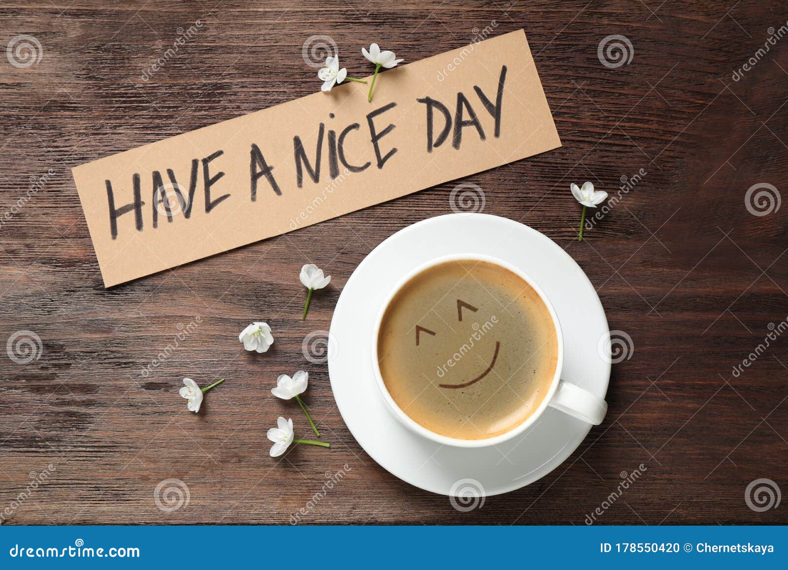 Coffee, Flowers and Card with HAVE a NICE DAY Wish on Wooden Table ...