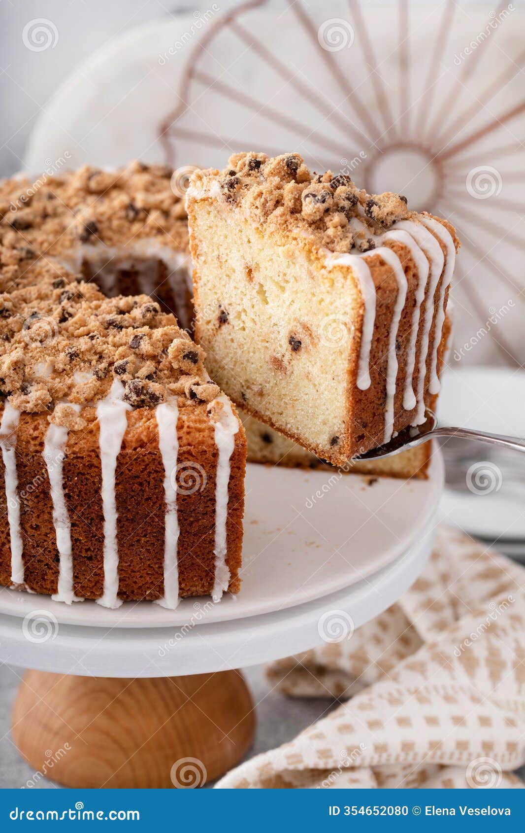 delicious crumb cake with icing on plate