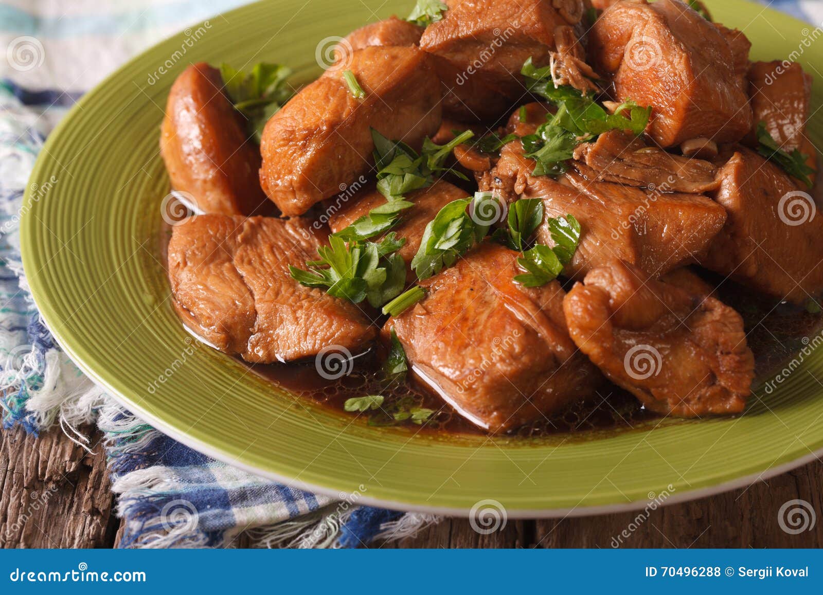delicious filipino food: adobo chicken with herbs close-up. horizontal
