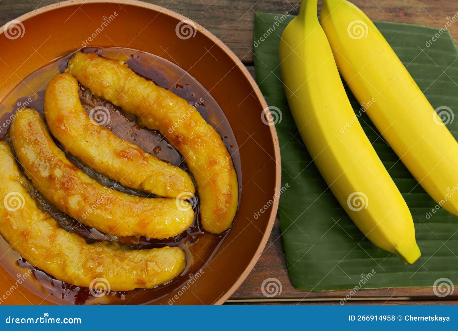 Delicious Fresh and Fried Bananas on Wooden Table, Flat Lay Stock Photo