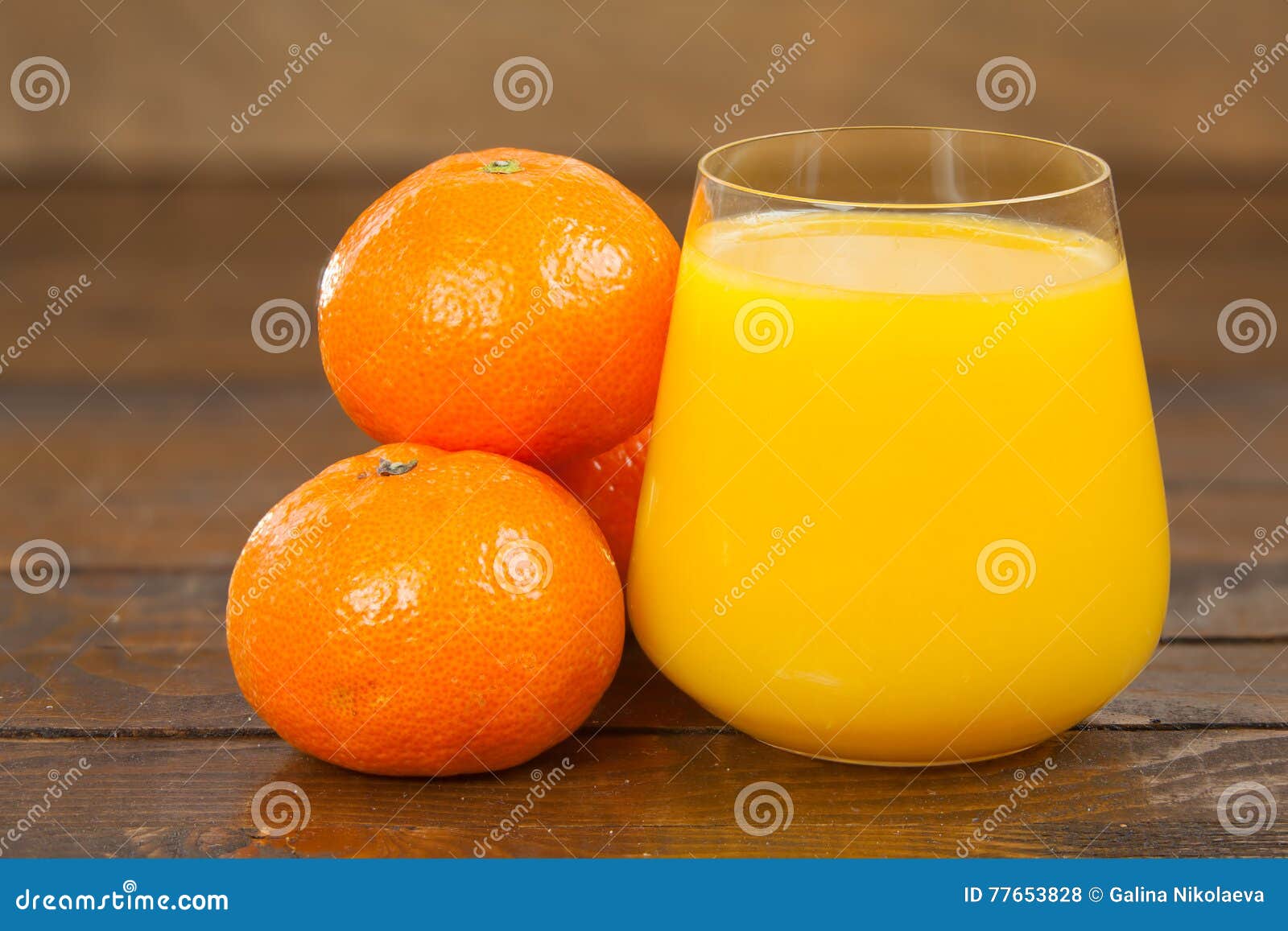 Delicious Fresh Squeezed Tangerine Juice in Transparent Glass Stock