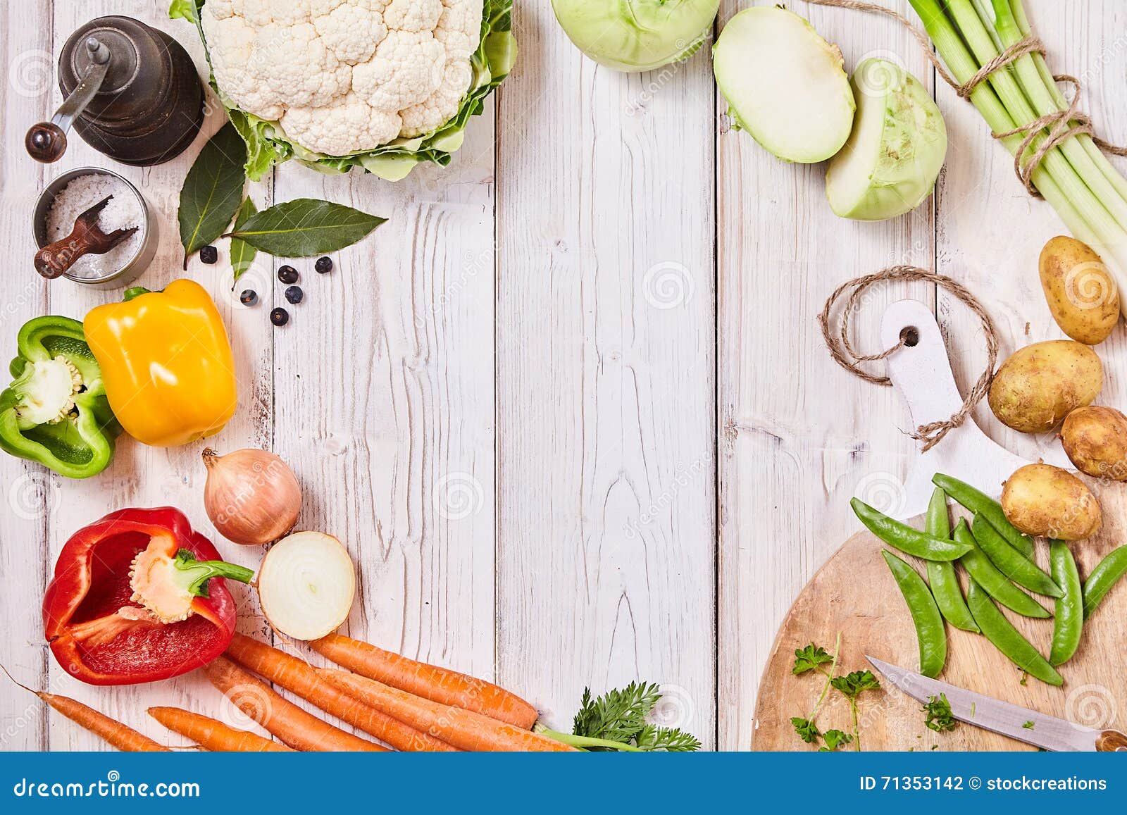 delicious fresh veggies forming a frame on wood