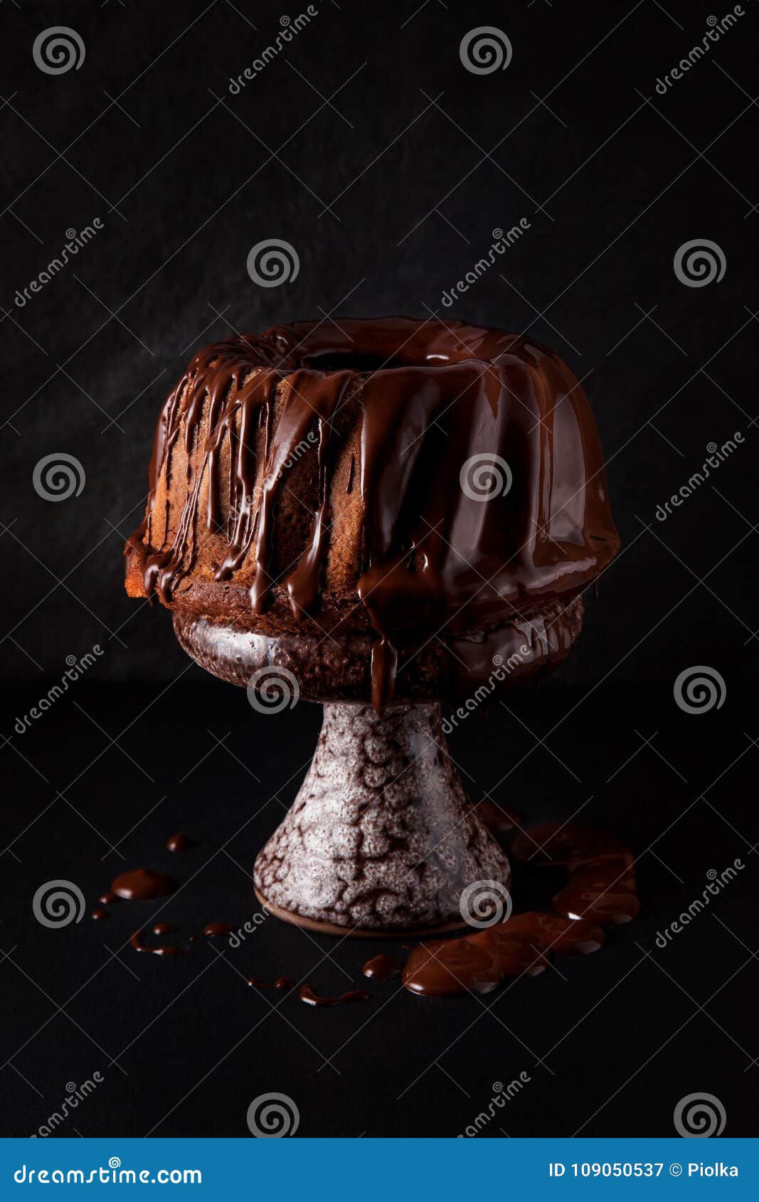 delicious freshly baked pie with chocolate couverture on slate plate
