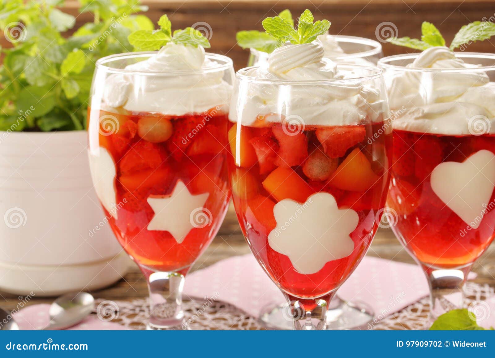 Delicious Fruits Jelly Dessert in a Glass with White Gelatin Shape