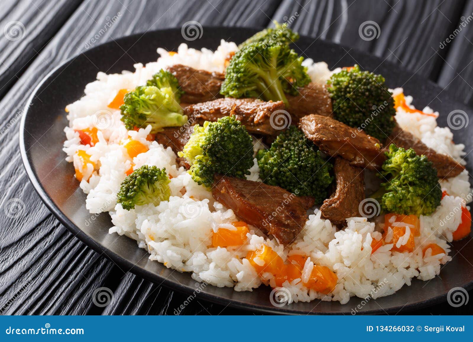 Delicious Grilled Beef with Broccoli Served with Rice and Persimmon
