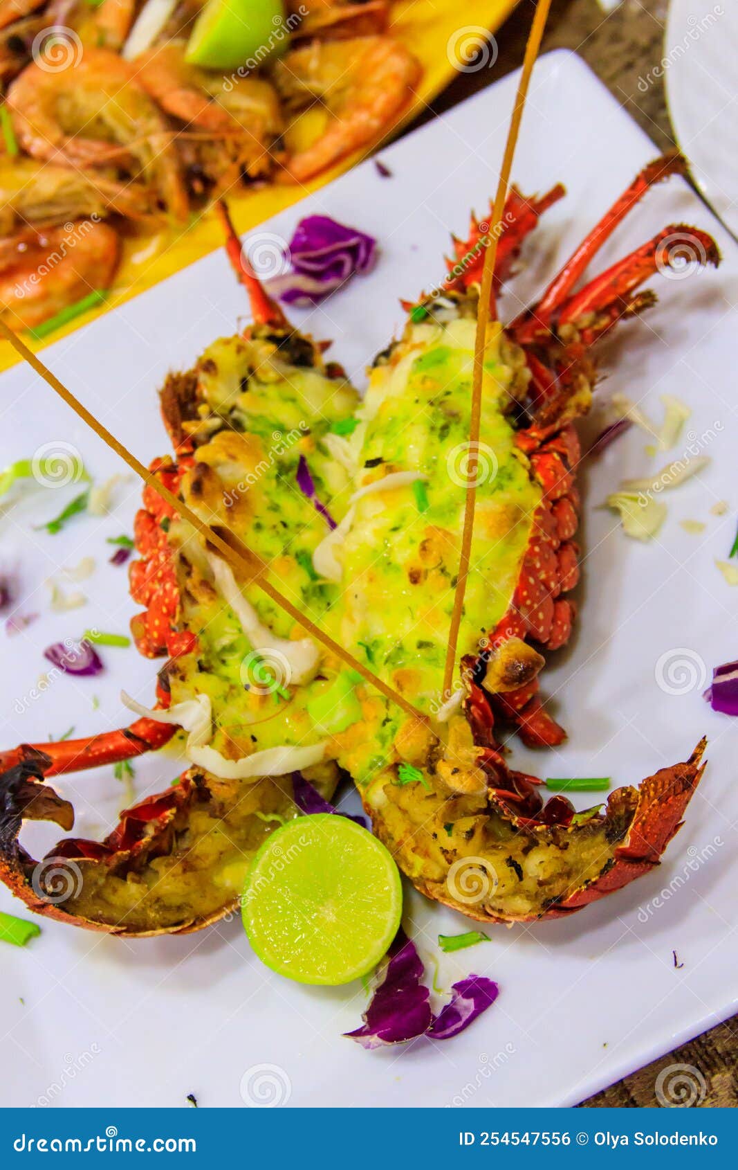 Delicious Grilled Lobster in a White Plate in Restaurant Stock Photo