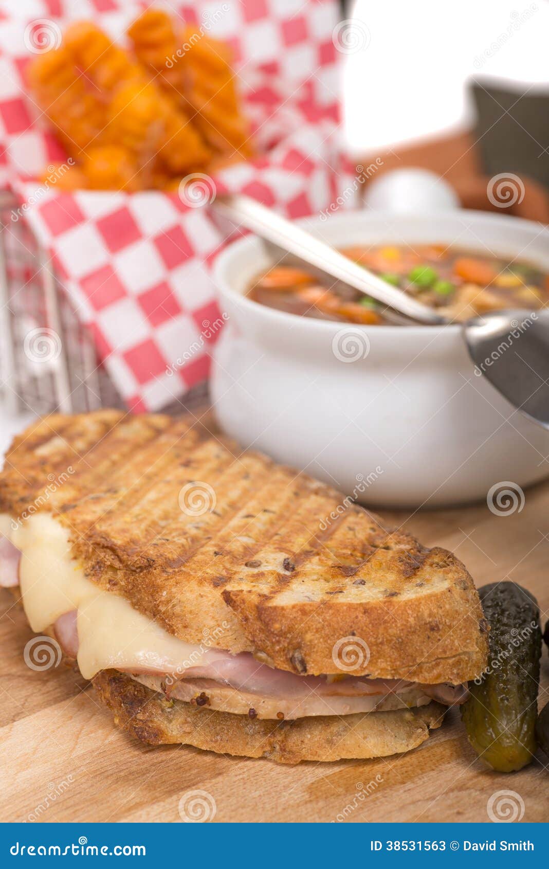 Delicious Ham, Pork and Swiss Cheese Panini with Vegetable Soup Stock ...