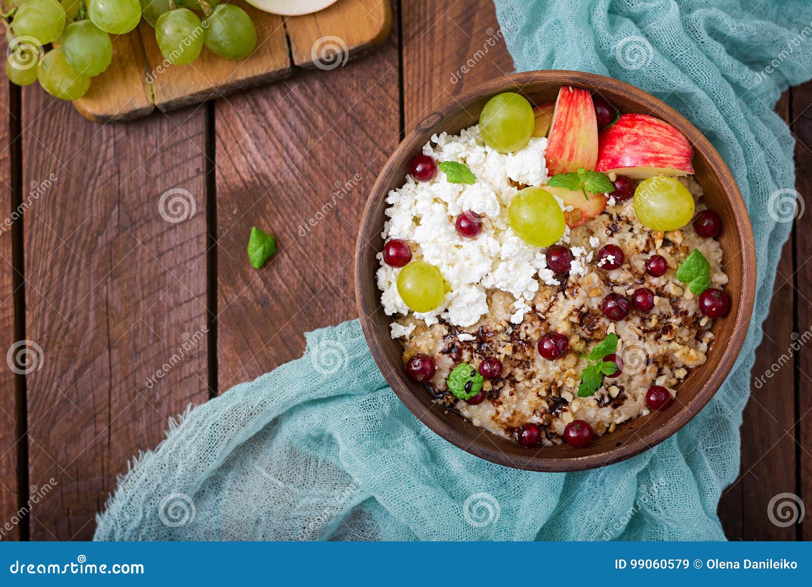 Delicious And Healthy Oatmeal With Grapes Nuts Apples And