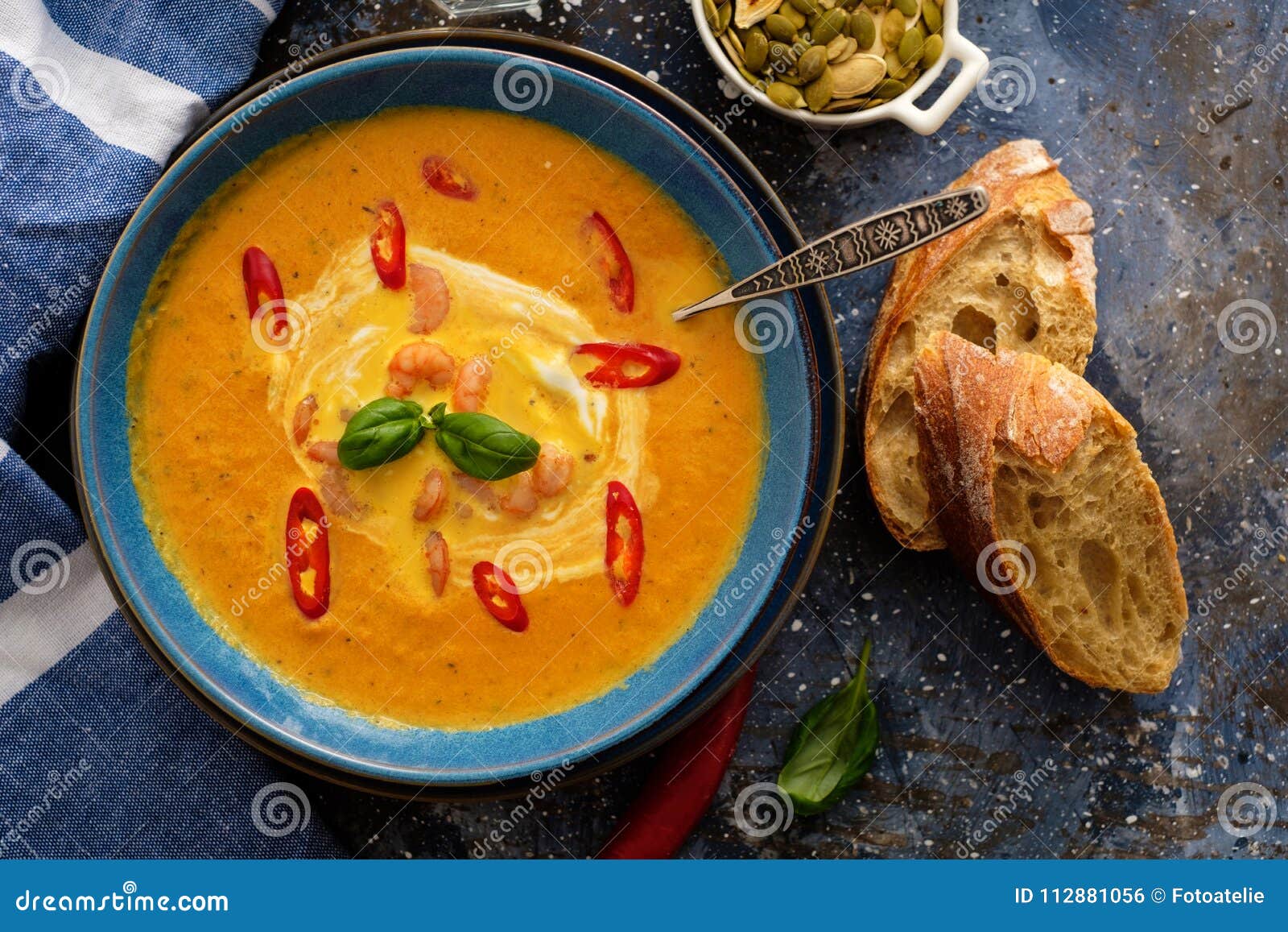 Delicious Homemade Pumpkin Soup with Prawns, Chili and Basil Lea Stock ...