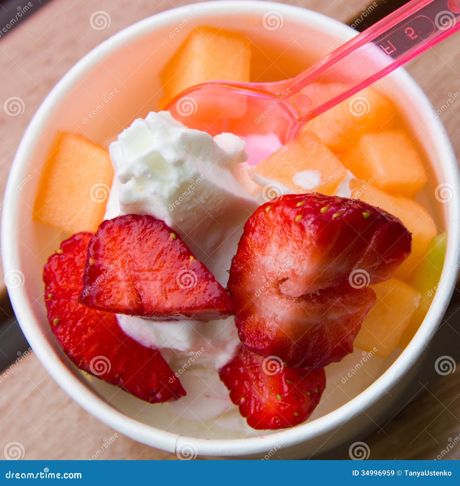 Delicious Ice Cream with Strawberry and Melon Topping Stock Image