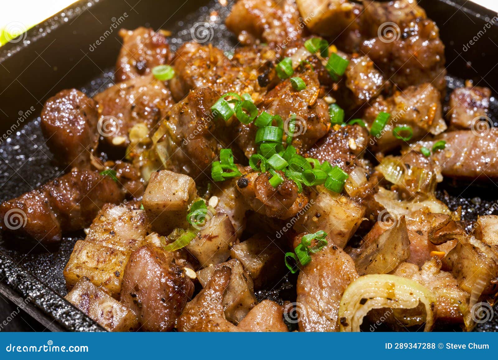 A Delicious Japanese Dish with Sizzling Beef and Beef Stock Photo