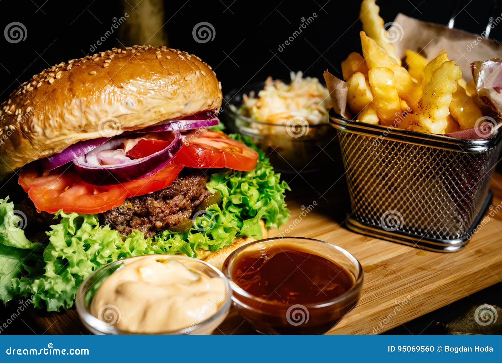 delicious juicy beef burger, american style food with french fries and coleslaw salad
