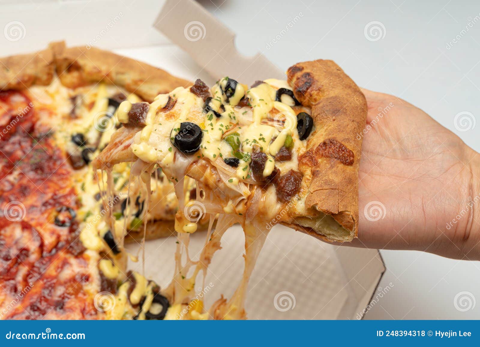 Delicious looking pizza stock photo. Image of tomato 248394318