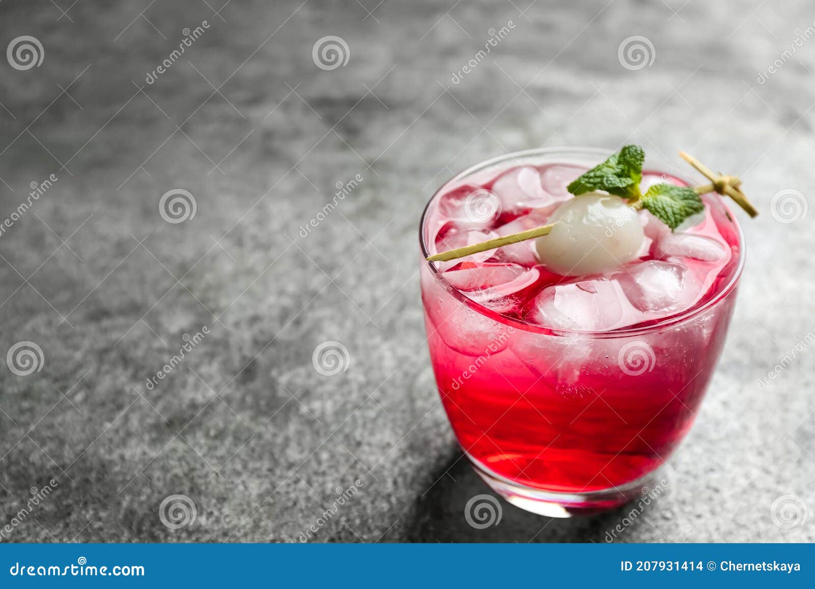 Delicious Lychee Cocktail with Mint on Grey Table. Space for Text Stock