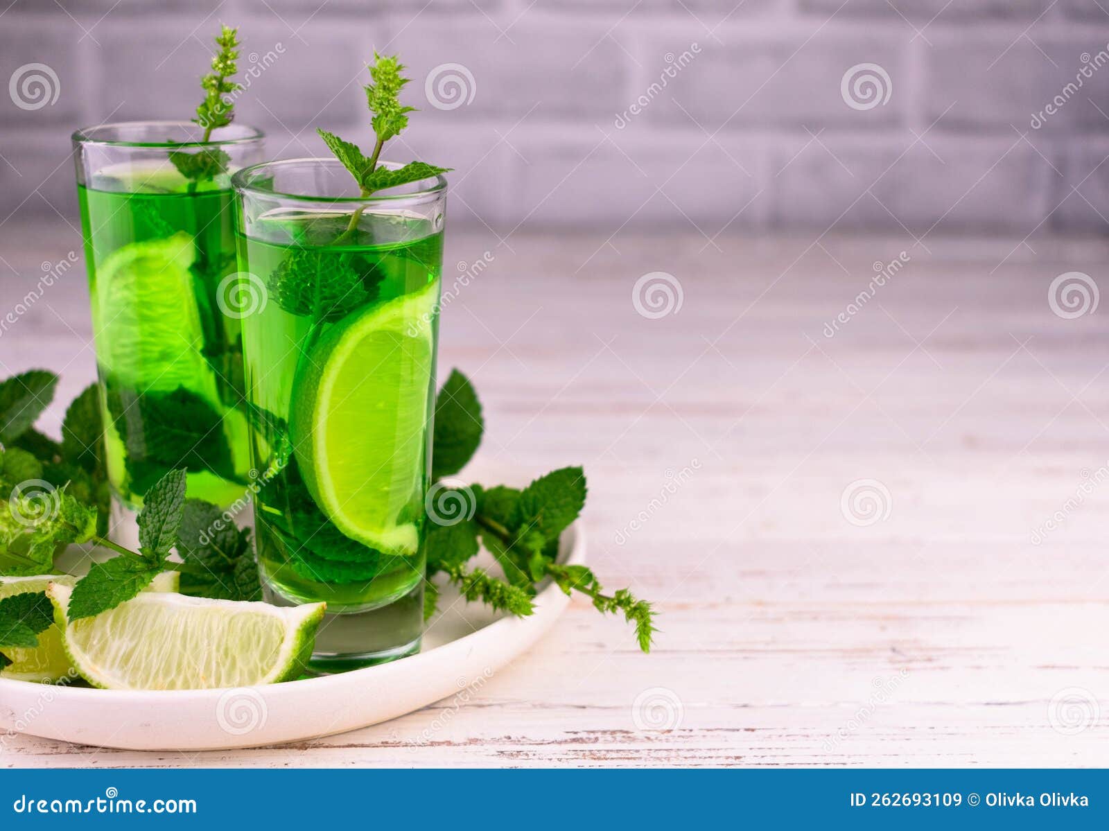 Delicious Mint Liqueur with Lime and Green Mint Leaves.Copy Space