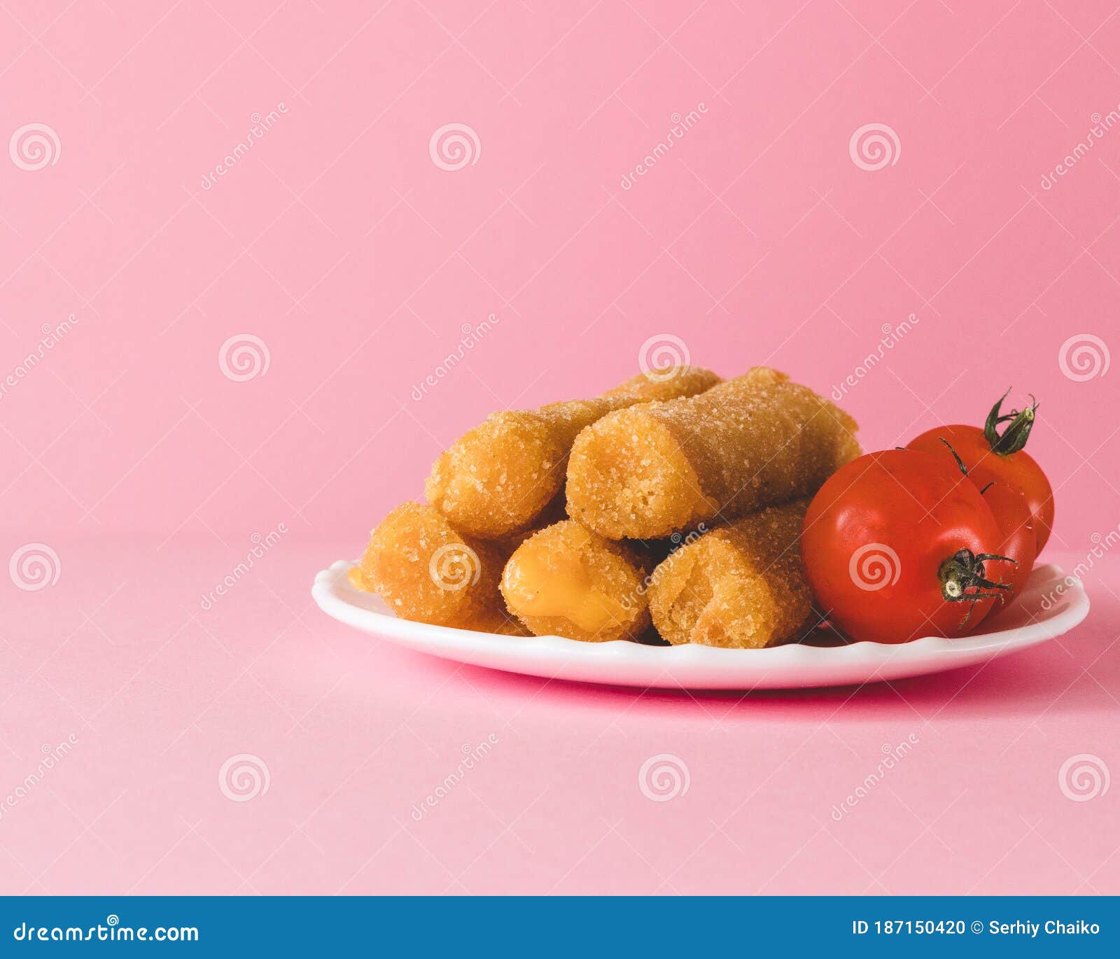 Delicious Mozzarella Cheese Sticks Cheese Sticks with Tomato on Pink Background Stock Photo