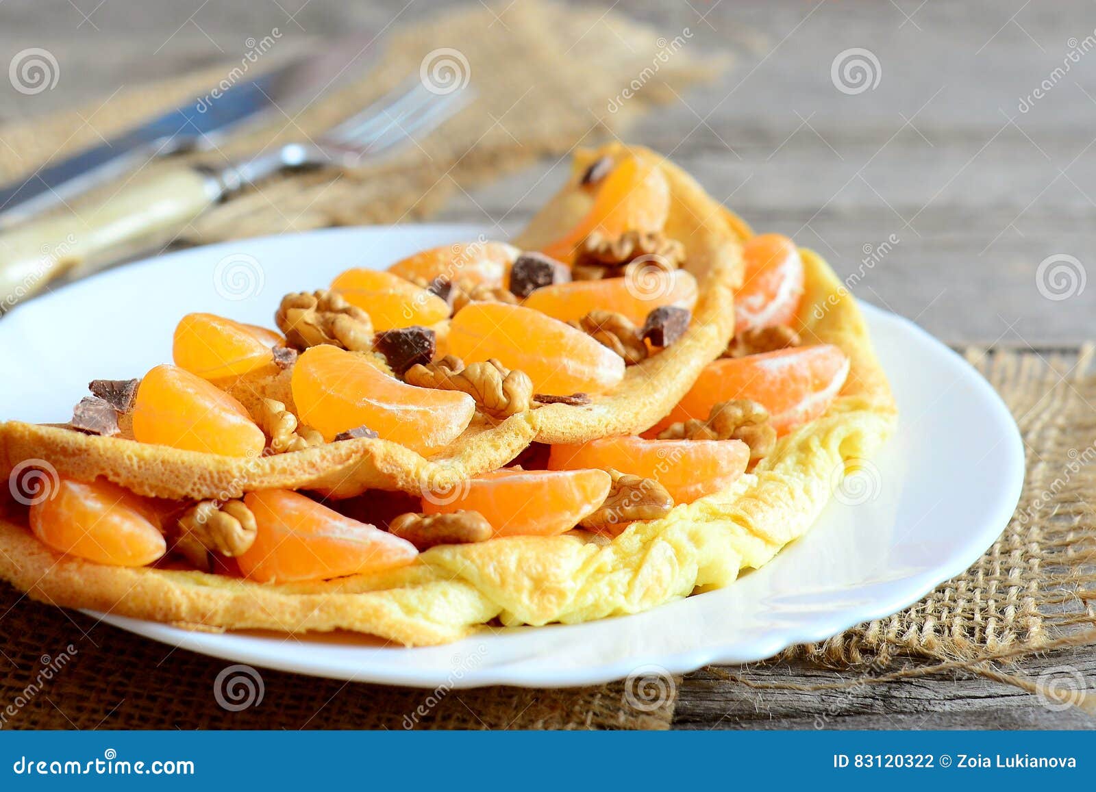 Delicious Omelette with Fruit, Nuts and Chocolate on the Plate. Fried ...