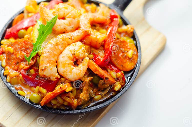 Delicious Paella, Cooked Risotto Rice with Chicken Thigh, King Prawns