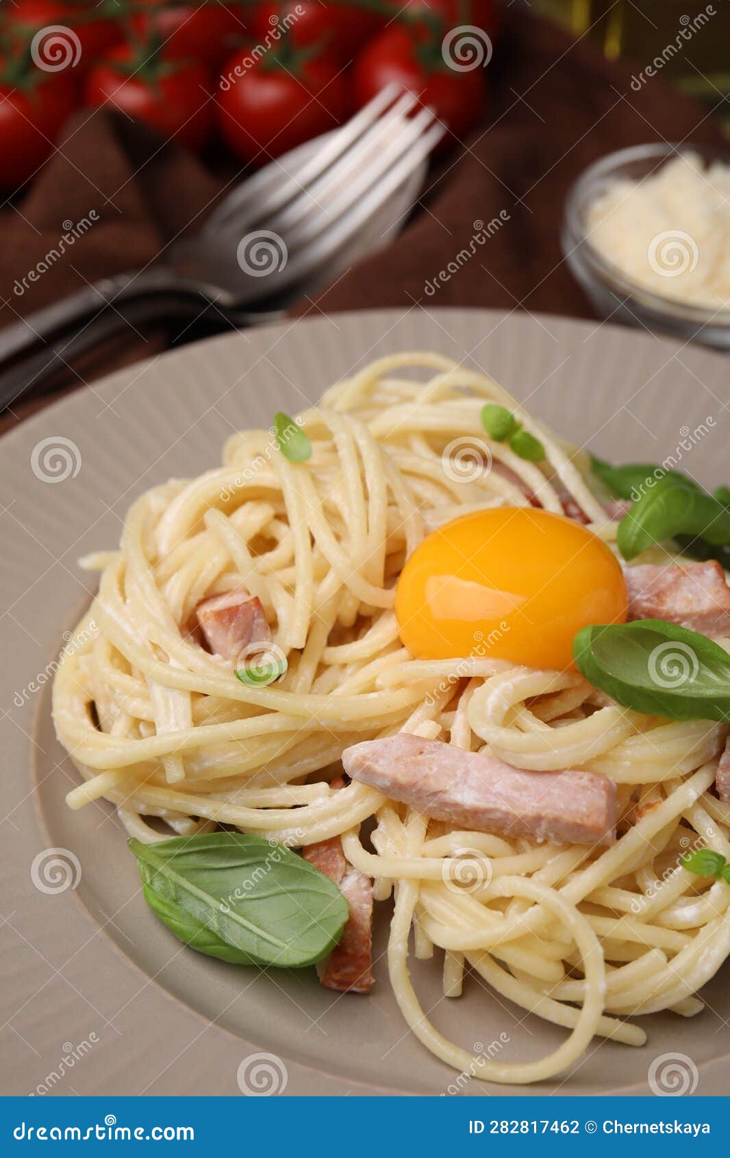 Delicious Pasta Carbonara with Egg Yolk on Plate, Closeup Stock Photo