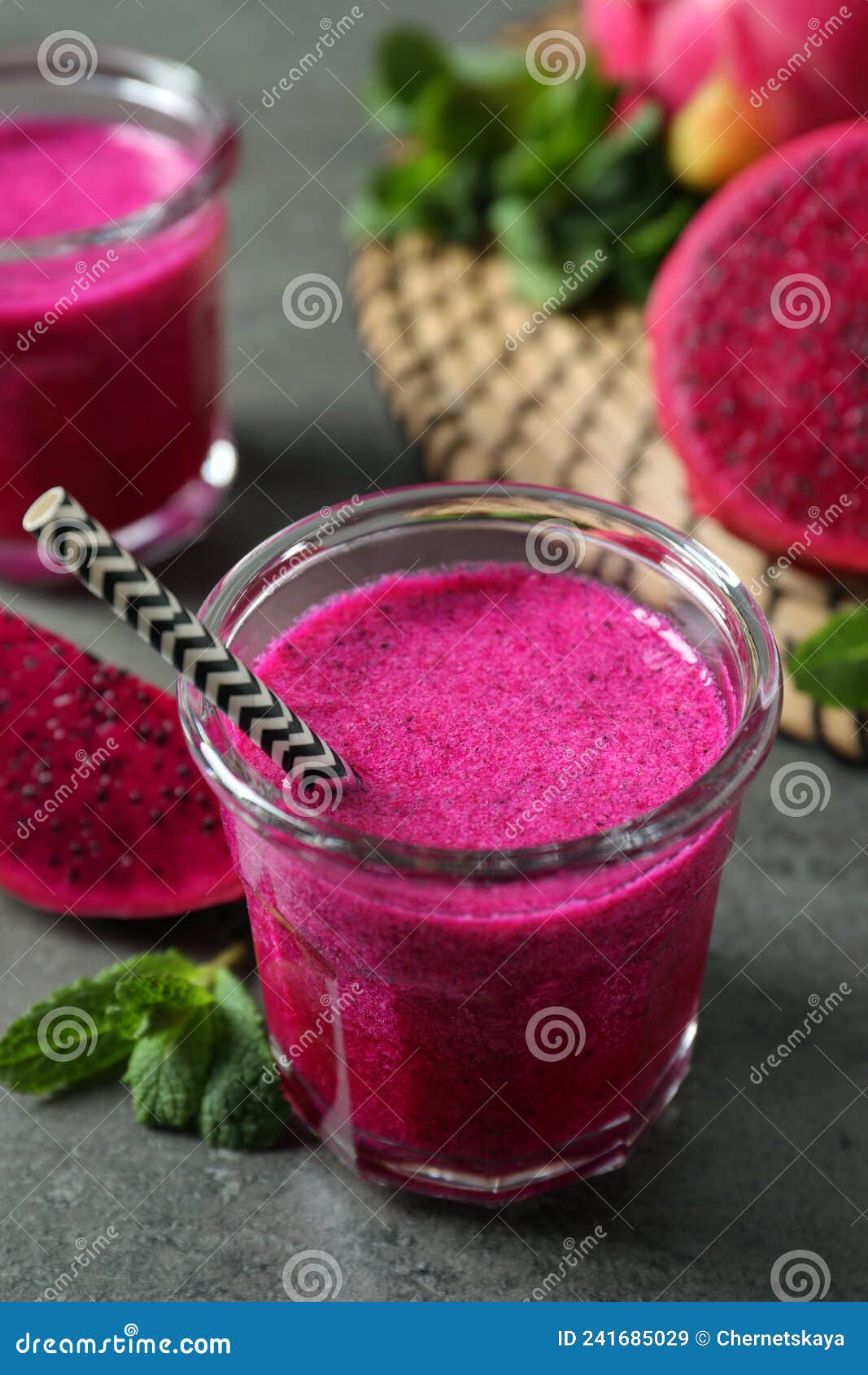 Delicious Pitahaya Smoothie, Fruits and Fresh Mint on Grey Table Stock ...