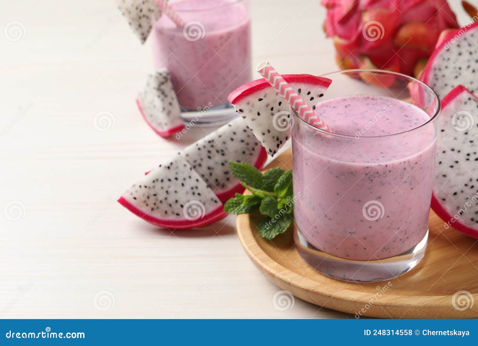 Delicious Pitahaya Smoothie, Mint and Fresh Fruits on White Wooden ...