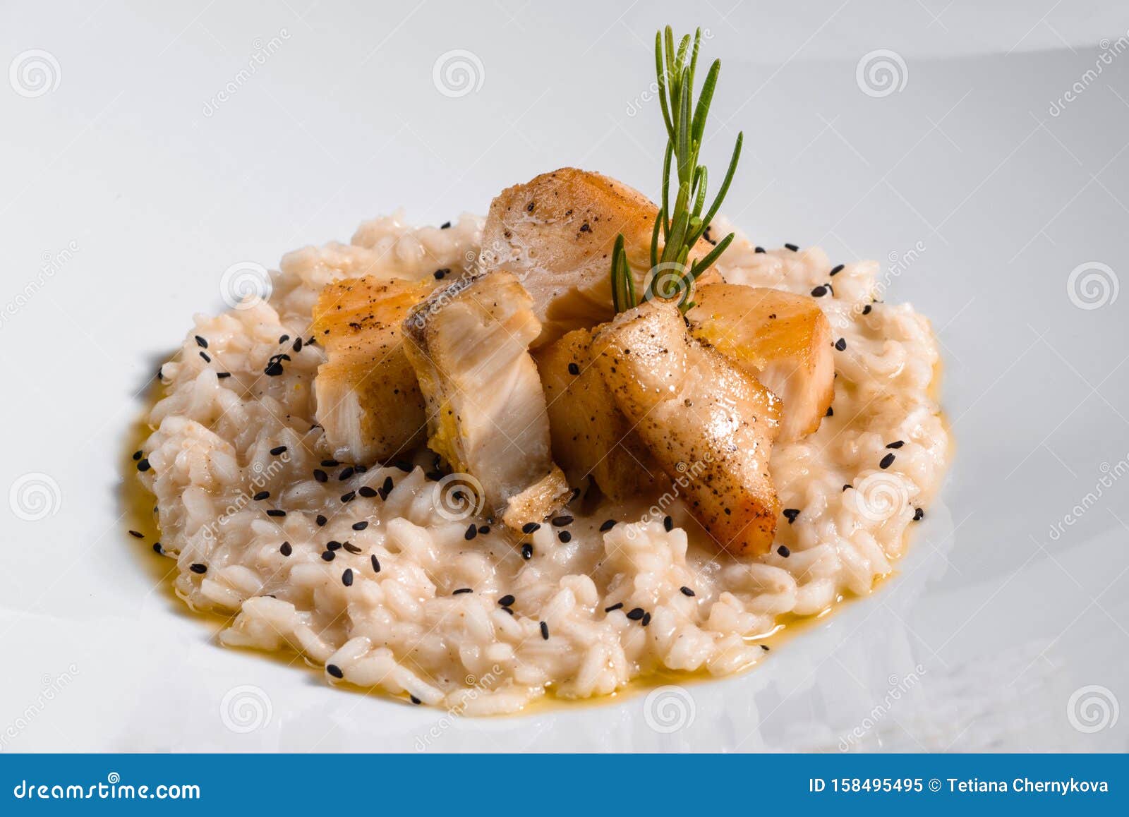 Delicious Risotto with Roasted Pieces of Chicken Fillet Stock Image
