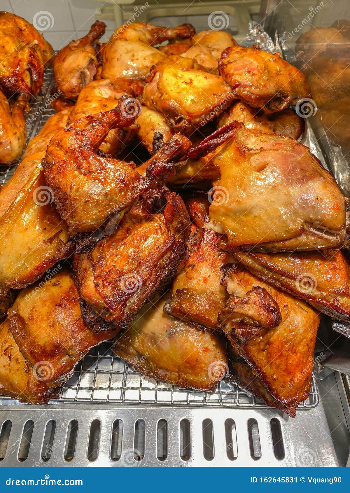 Delicious and Crispy Roasted Chicken Leg Quarters at Food Stall Stock ...