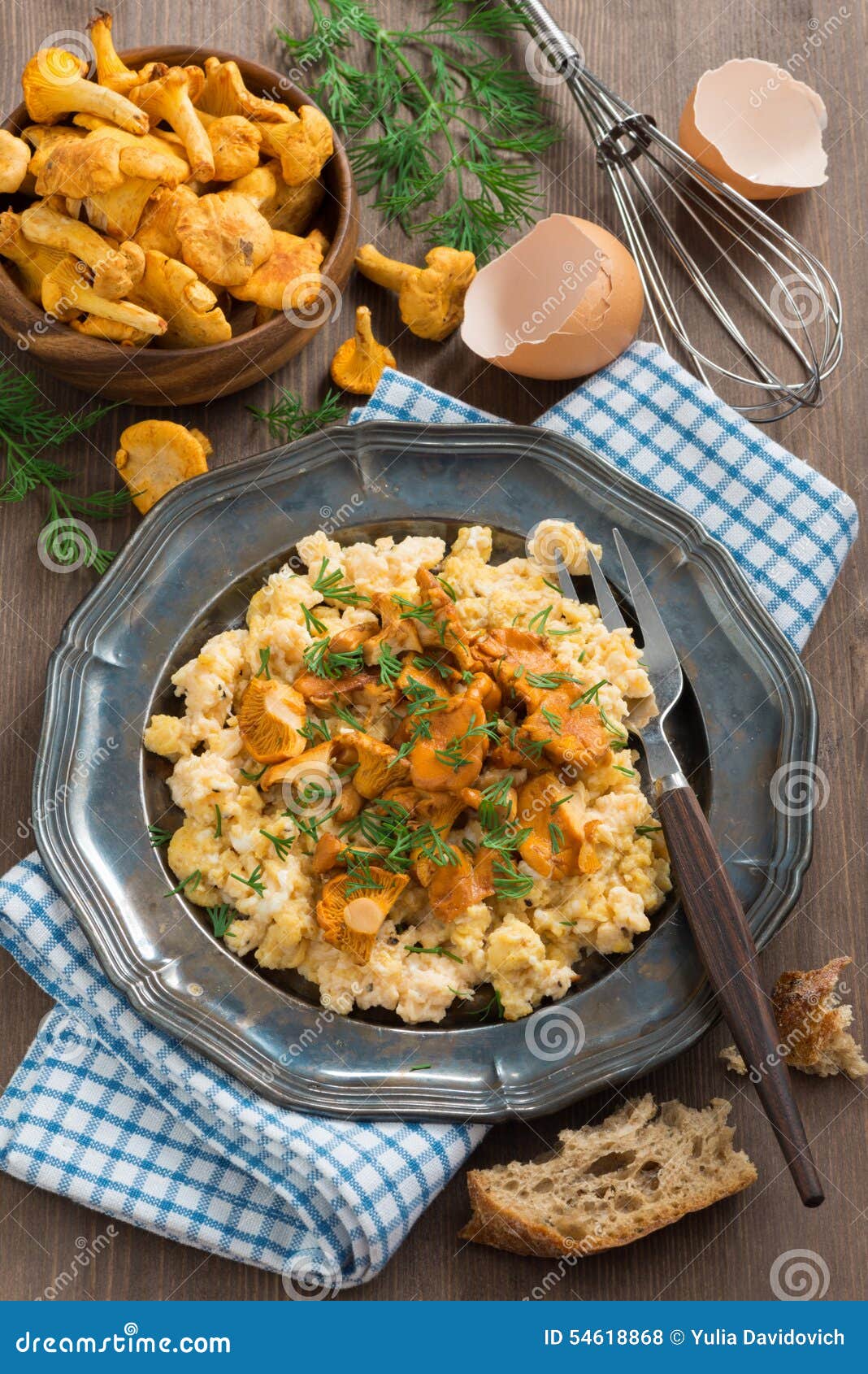 Delicious Scrambled Eggs with Chanterelles and Fresh Dill Stock Photo