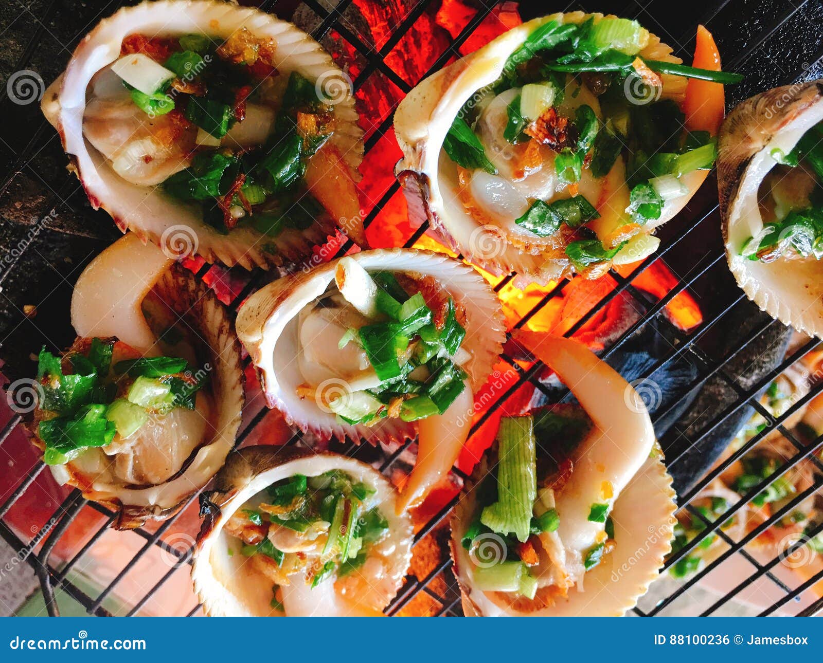 Delicious Shell or Clams Mussels on Hot Fire Coal Grill Stock Photo