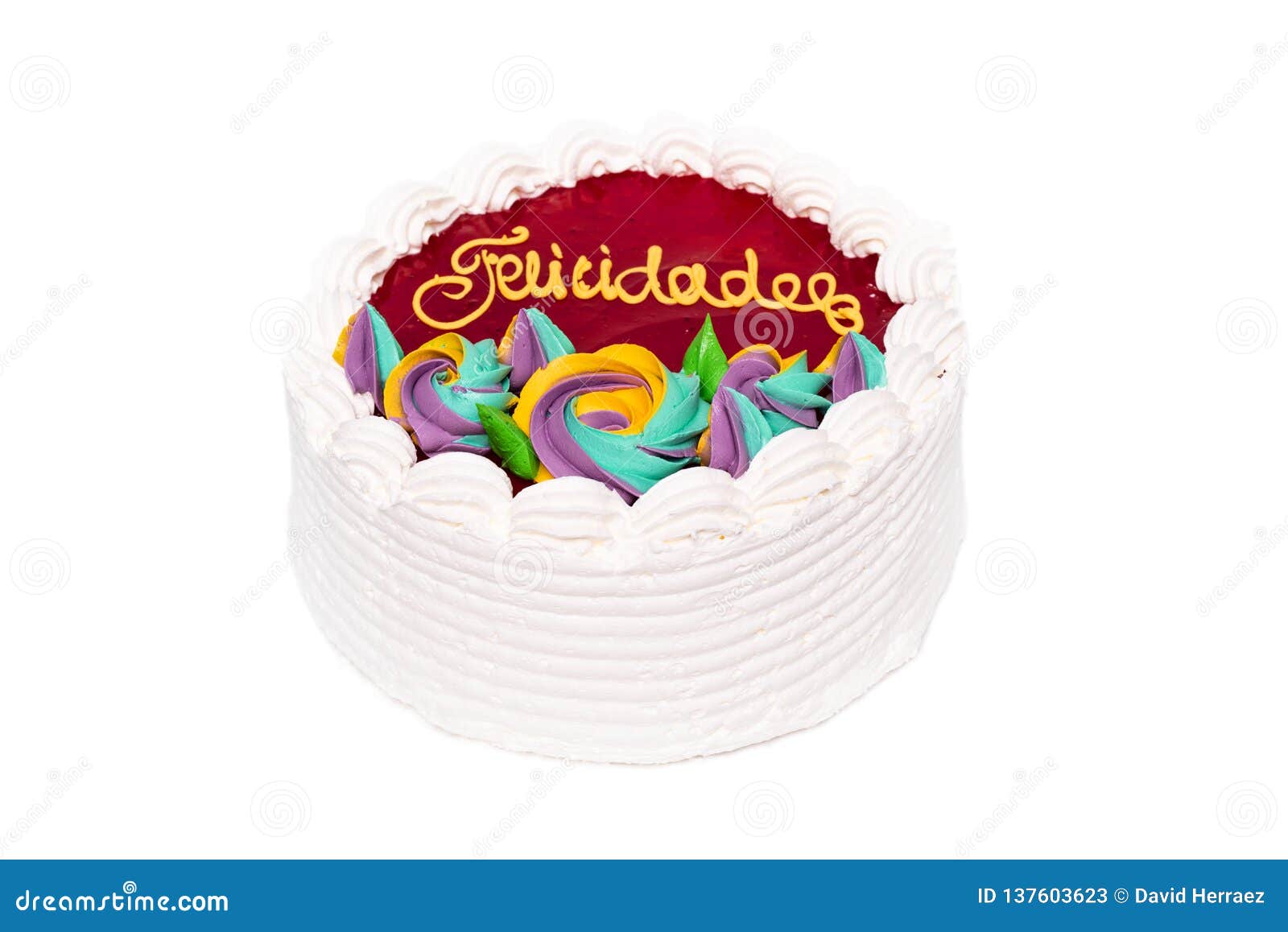 delicious spanish birthday cream cake on white  background. with spanish text felicidades, in the cake.