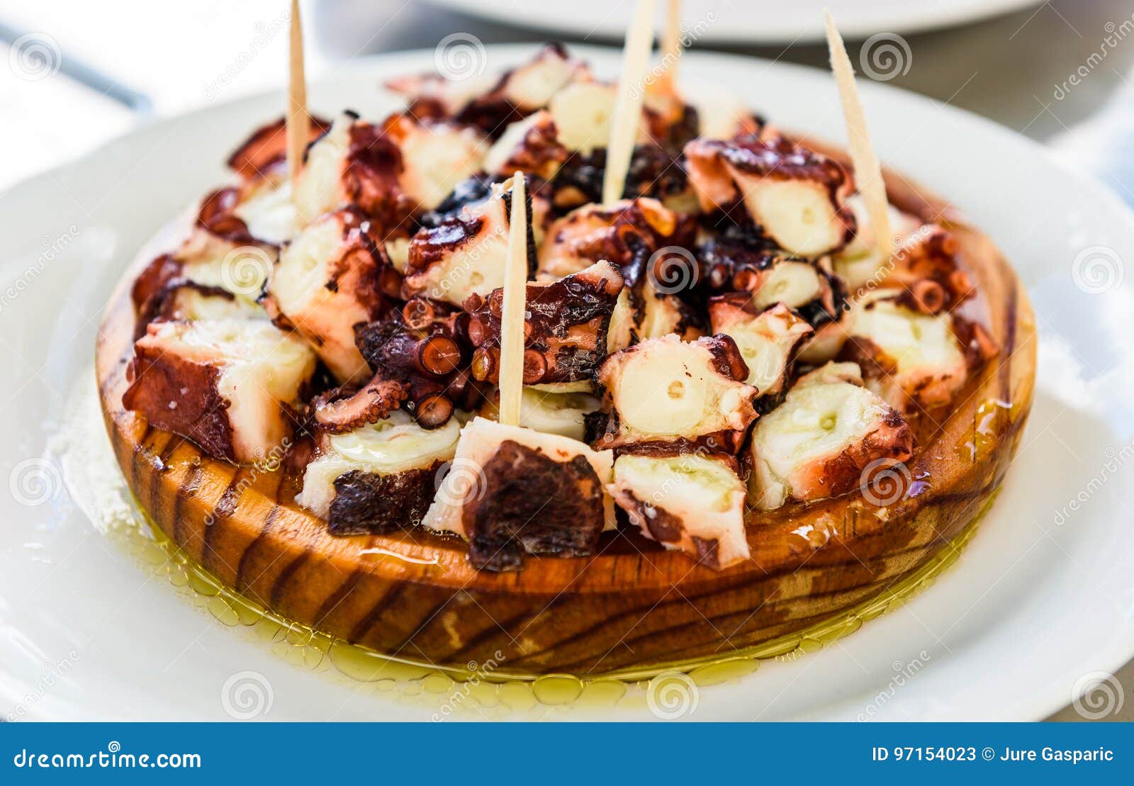 delicious spanish octopus on wooden plate pulpo a la gallega.