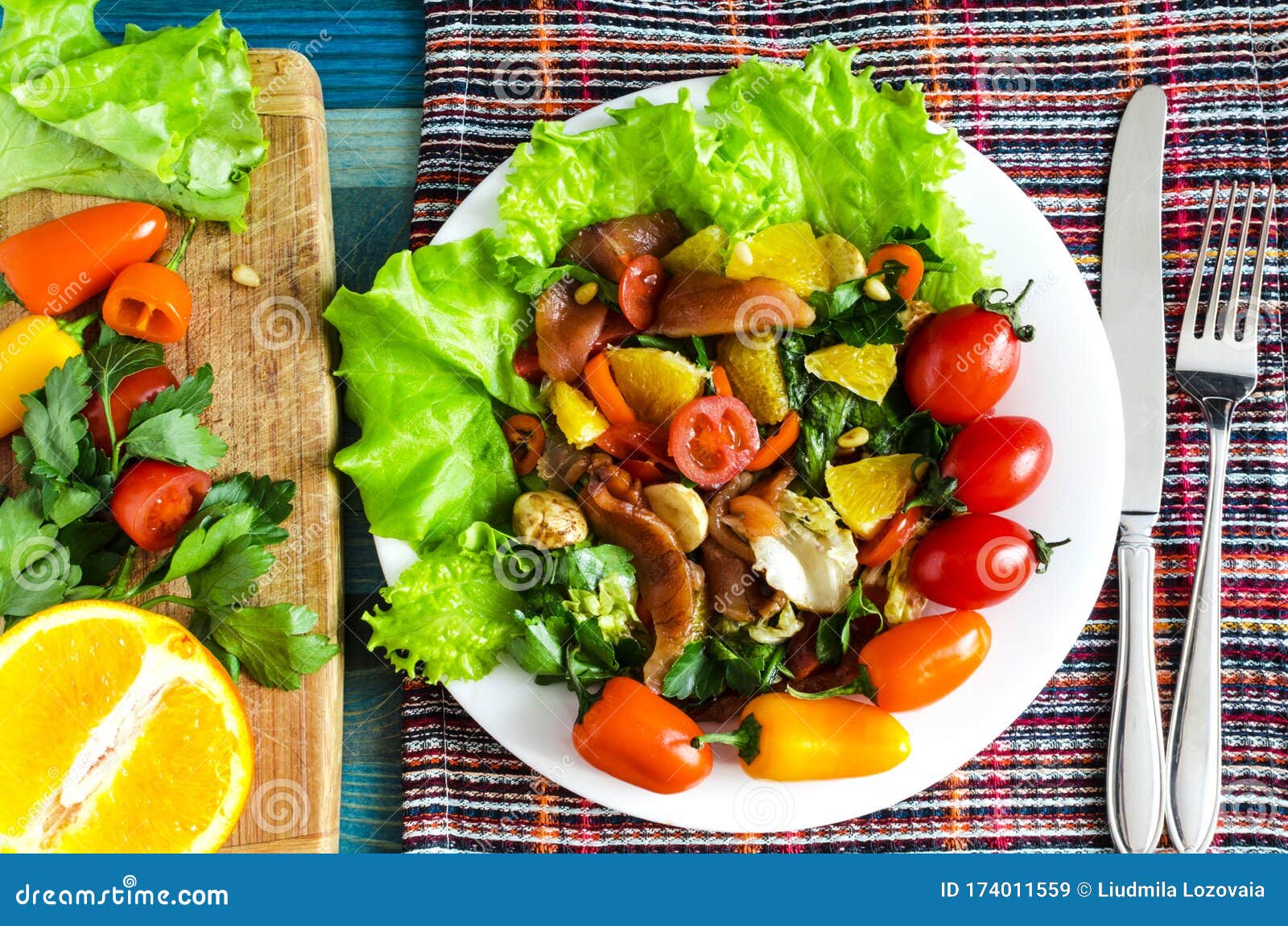 Delicious Spring Salad With Fish And Vegetables On A White Plate ...