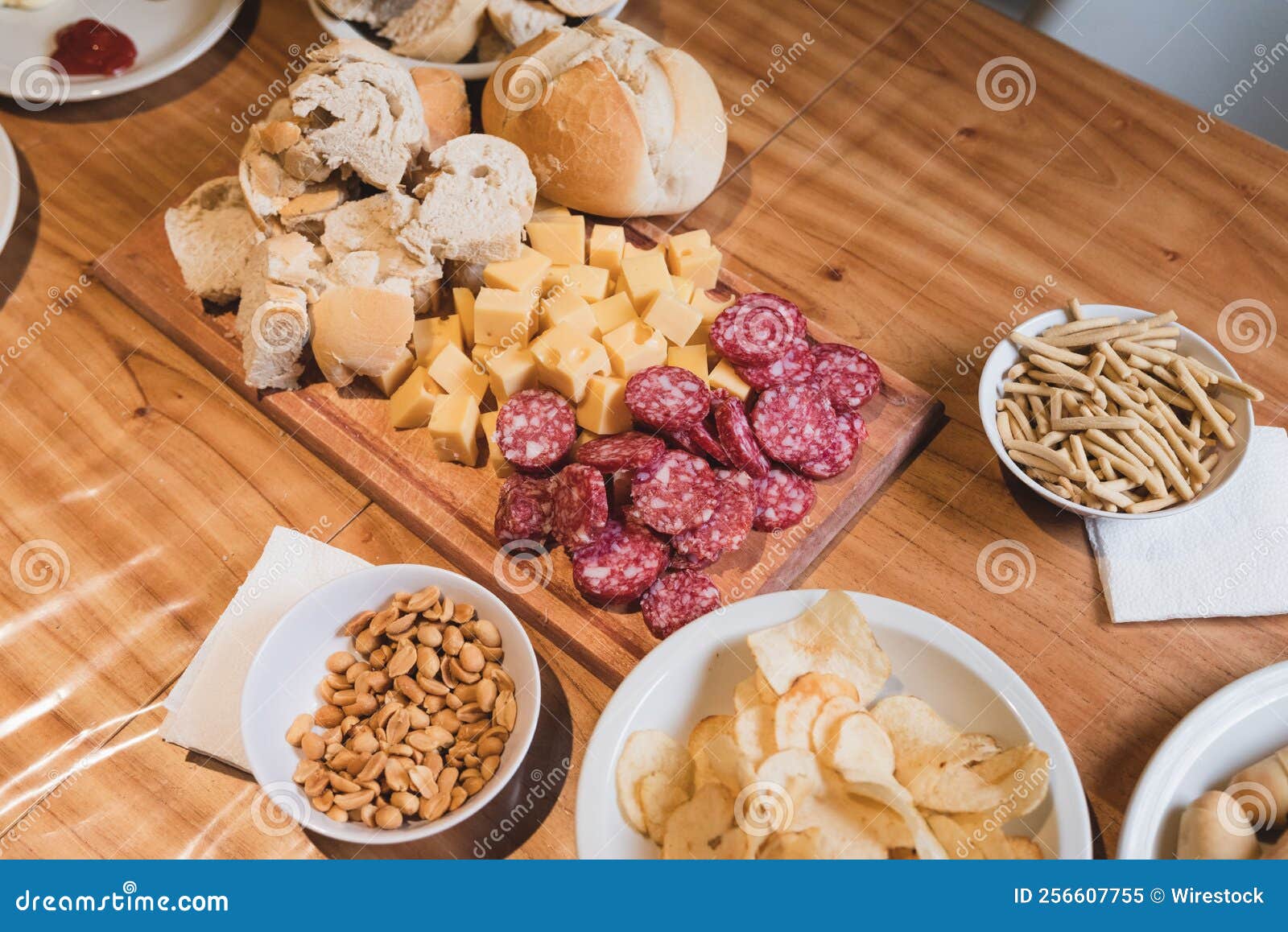Delicious Table of Snacks and Appetizers with Cheese, Salami, Chips and