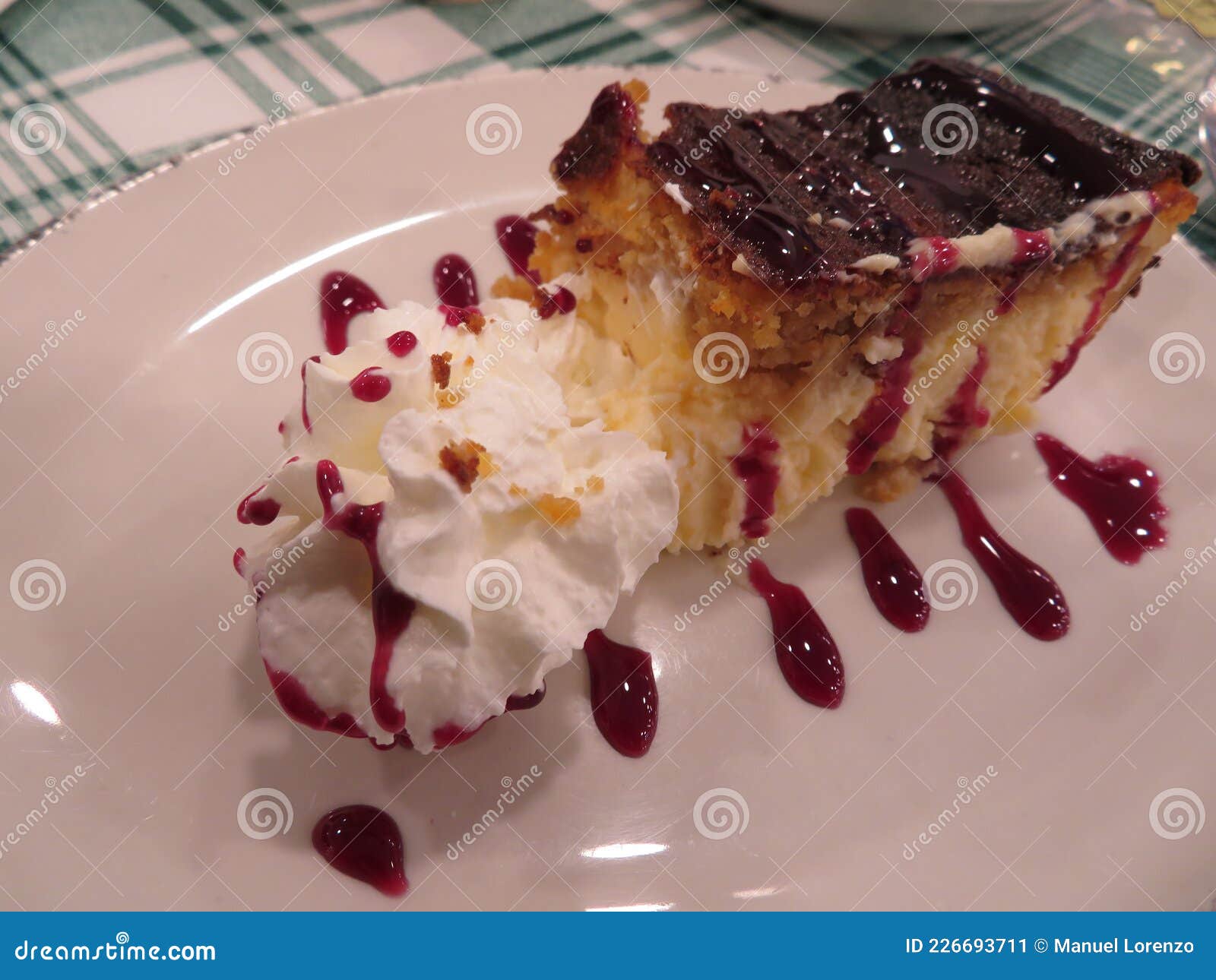 delicious tasty cheesecake sweet whipped raspberry sauce