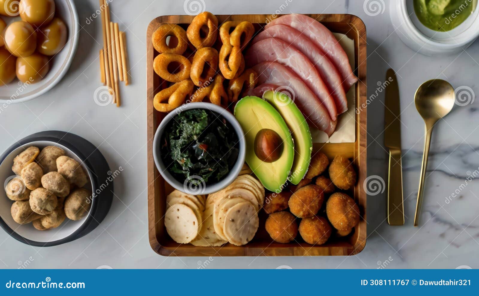 delicious and varied no carb snacks a selection of olives, guacamole, cheese, seaweed snacks, pork