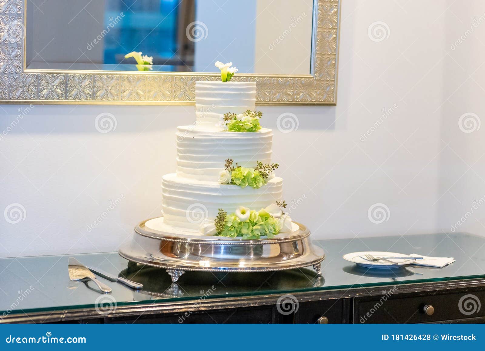 Delicious White Wedding Cake Decorated With Flowers On A Table Under A Mirror Stock Photo Image Of Beautiful Mirror 181426428
